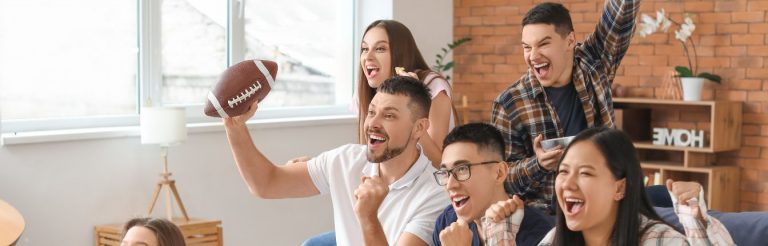 A group of friends watching a football game together.