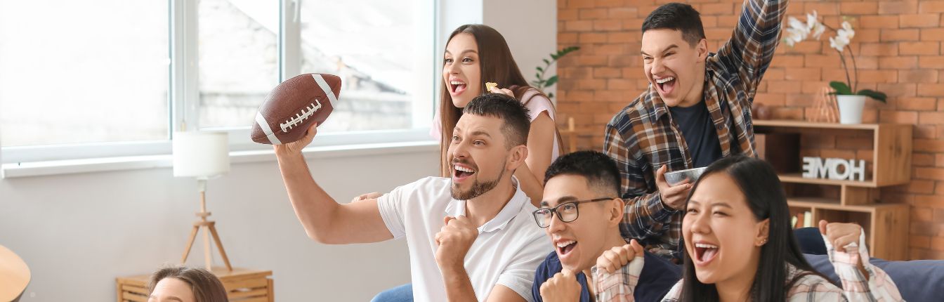 A group of friends watching a football game together.